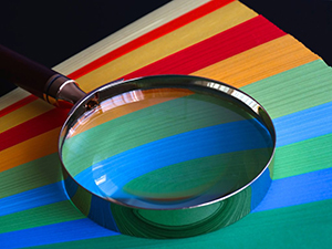Magnifying glass over color swatches